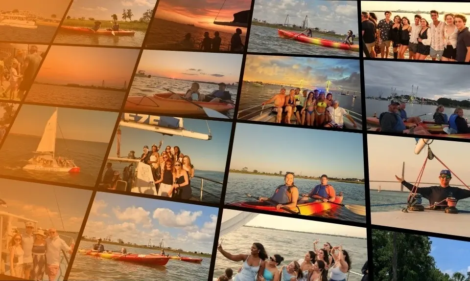 Kayakers paddling Shem Creek and the Palmetto Breeze catamaran under sail at sunset in Charleston Harbor